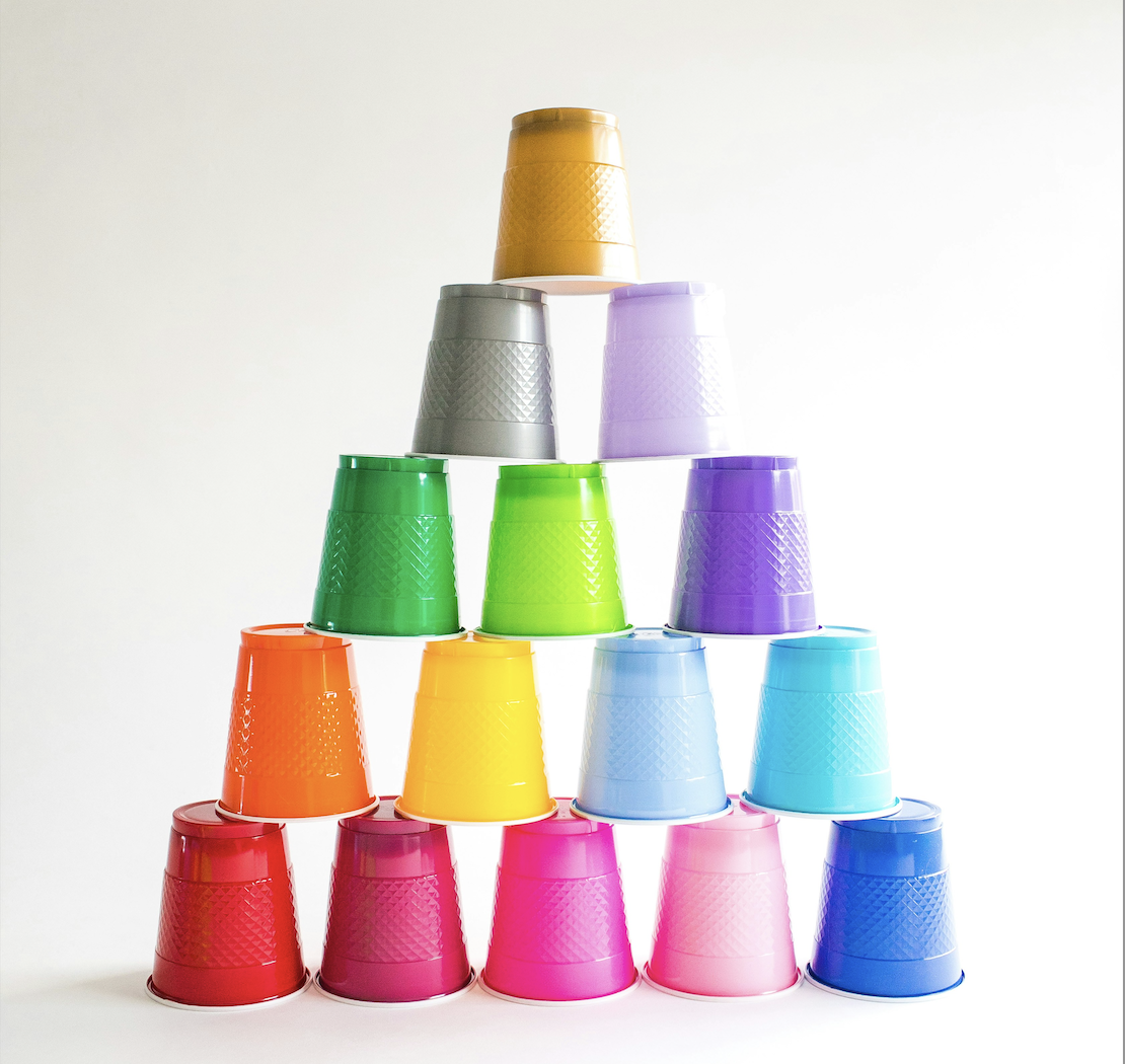 Colorful party cups stacked in a pyramid shape